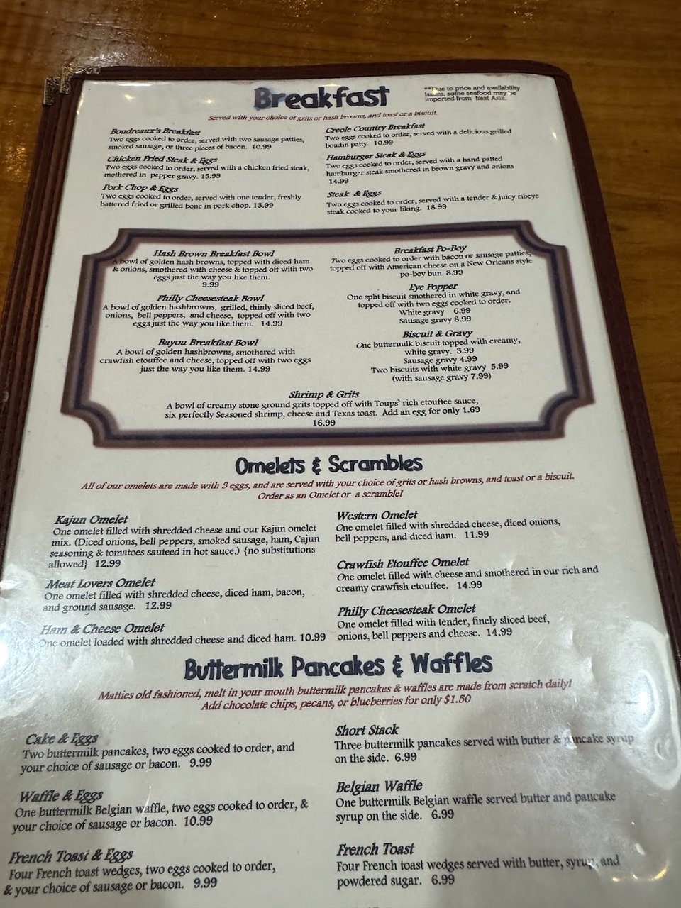 Breakfast and Cajun classics listed on a menu.