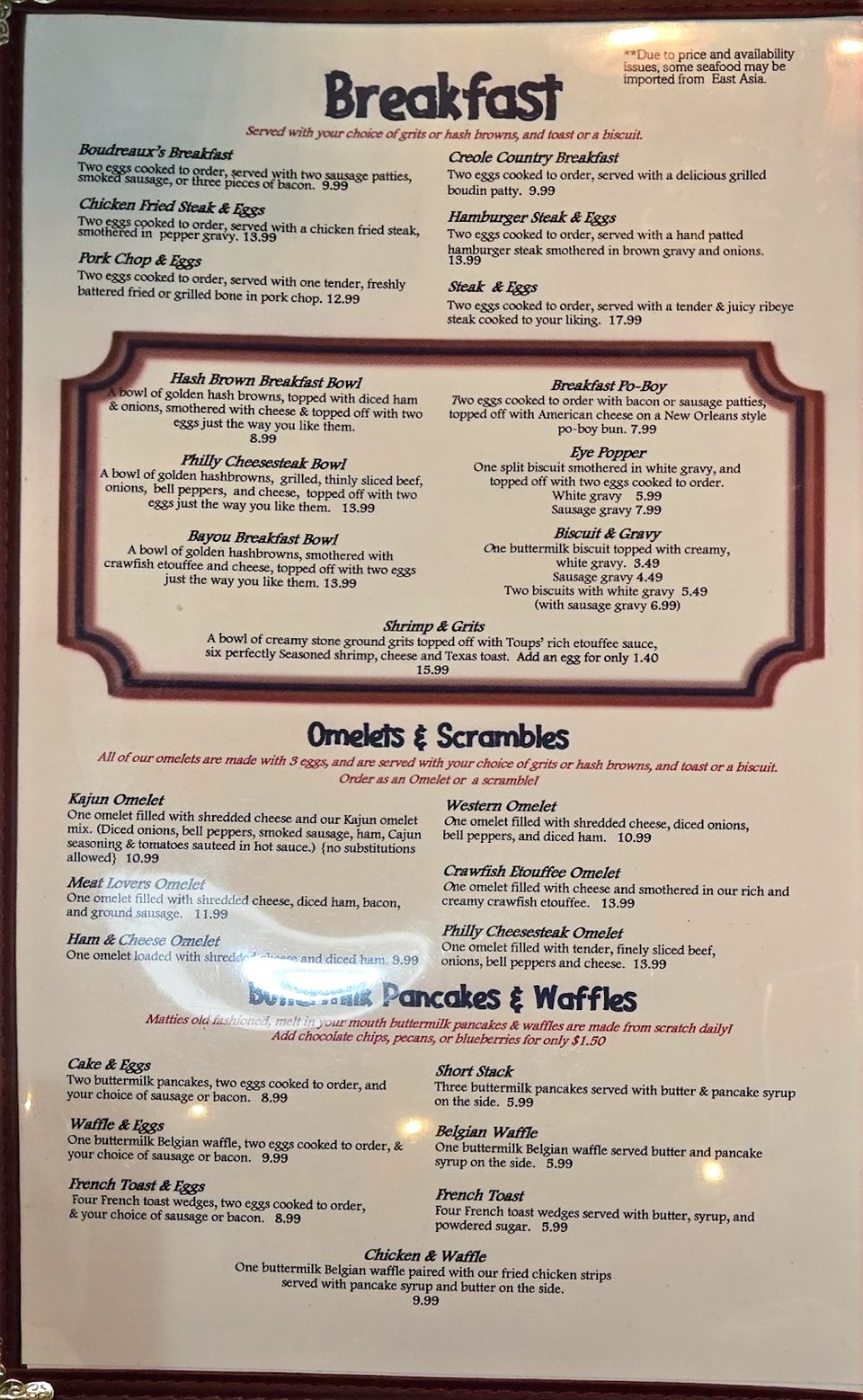 Menu page with shrimp platters and omelets.